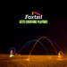 A nighttime beach scene shows glowing trails from a Foxtail LED tossed in motion, people enjoying this fun outdoor game, with the text “Foxtail LED Gets Everyone Playing!” displayed in white and green above.